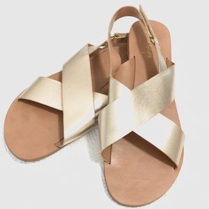 SOLD. gold crossed sandals | american eagle.